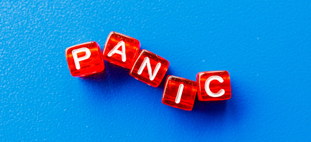 Red blocks spelling out the word "panic" against a blue background.